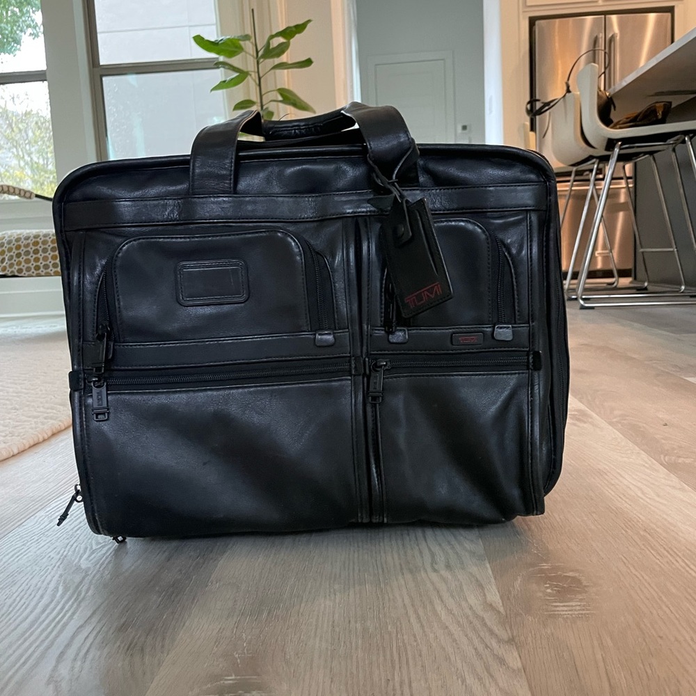 Tumi Luggage Carry-on black leather expandable 2 wheel rolling